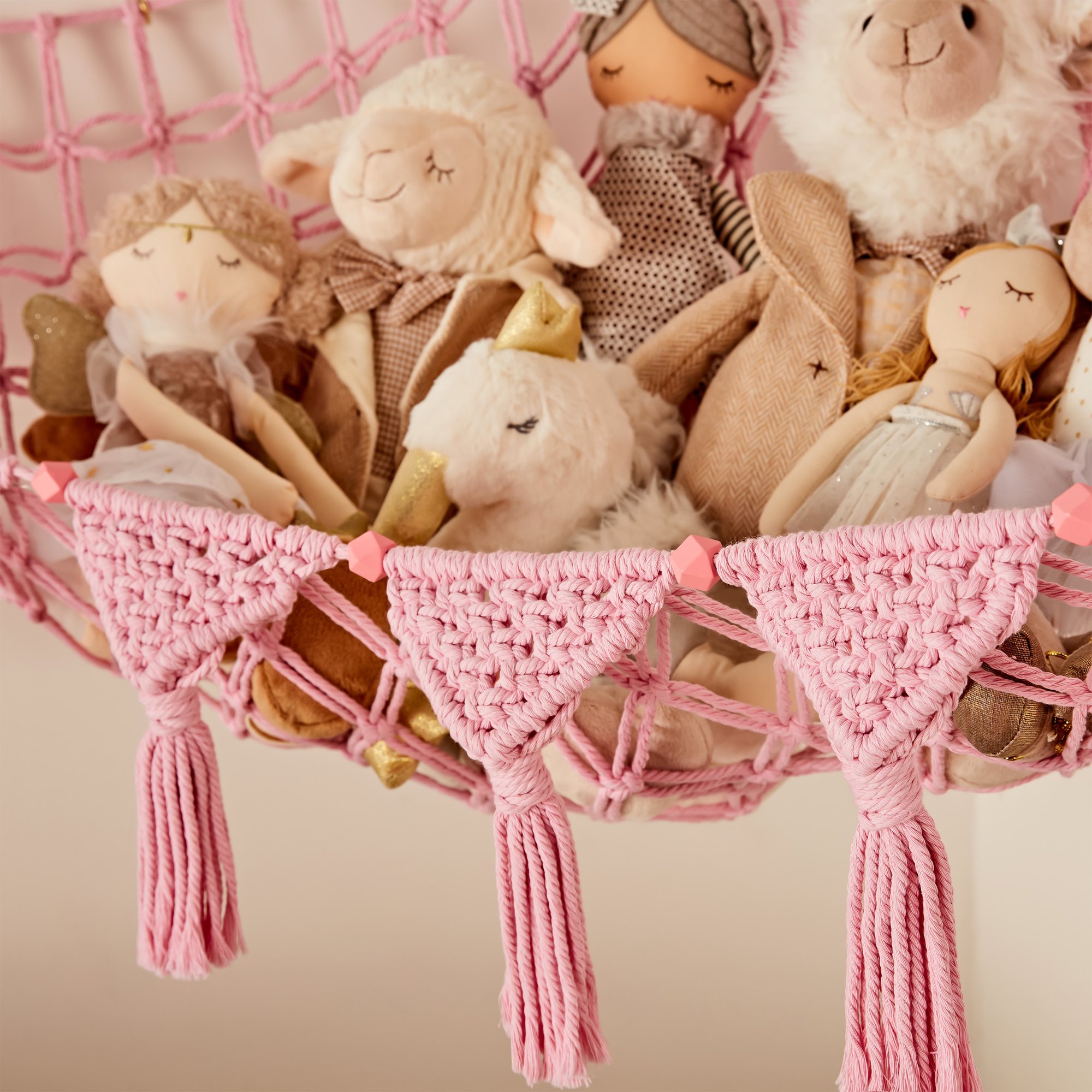 Grey TidyTeds hammock packed with stuffed animals